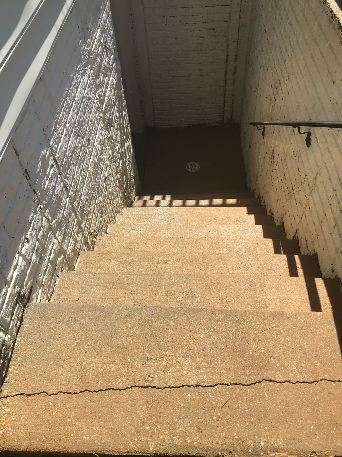 Bright clean concrete stairwell after pressure washing
