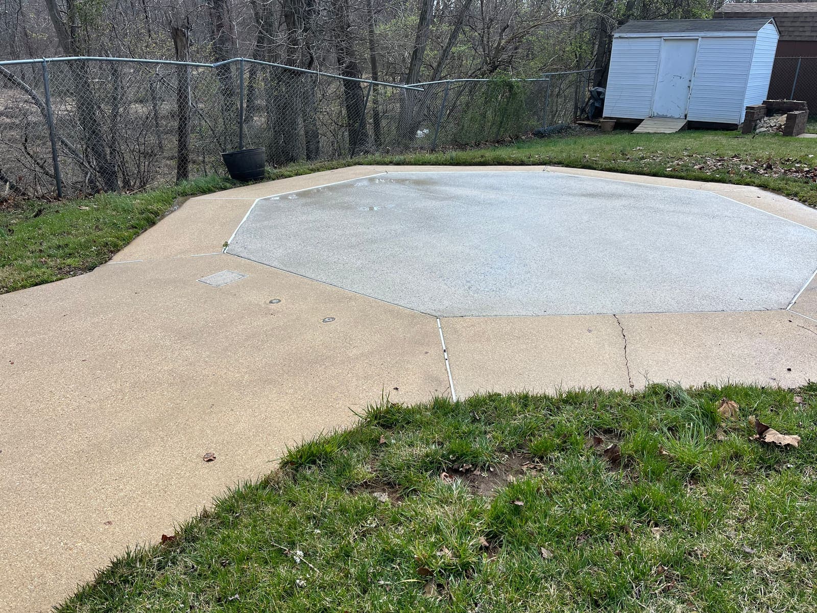 Backyard concrete patio slab after pressure washing