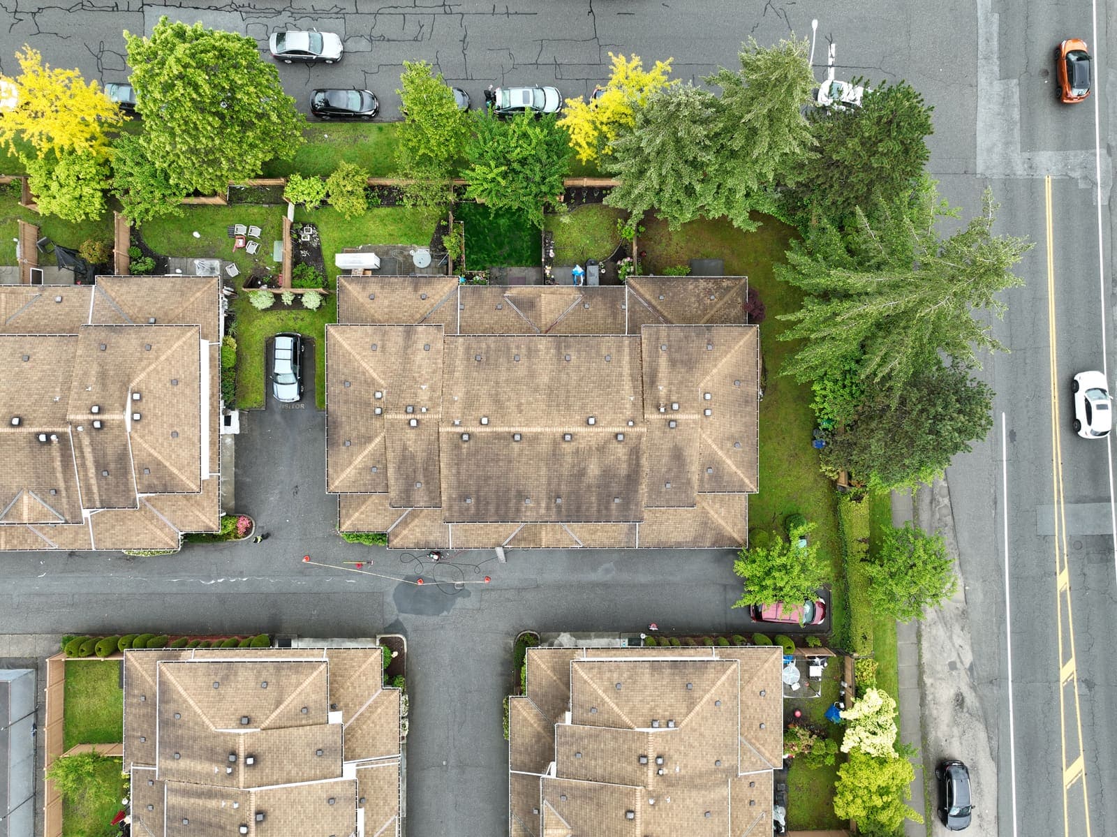 Aerial drone view of strata rooftops along a residential street
