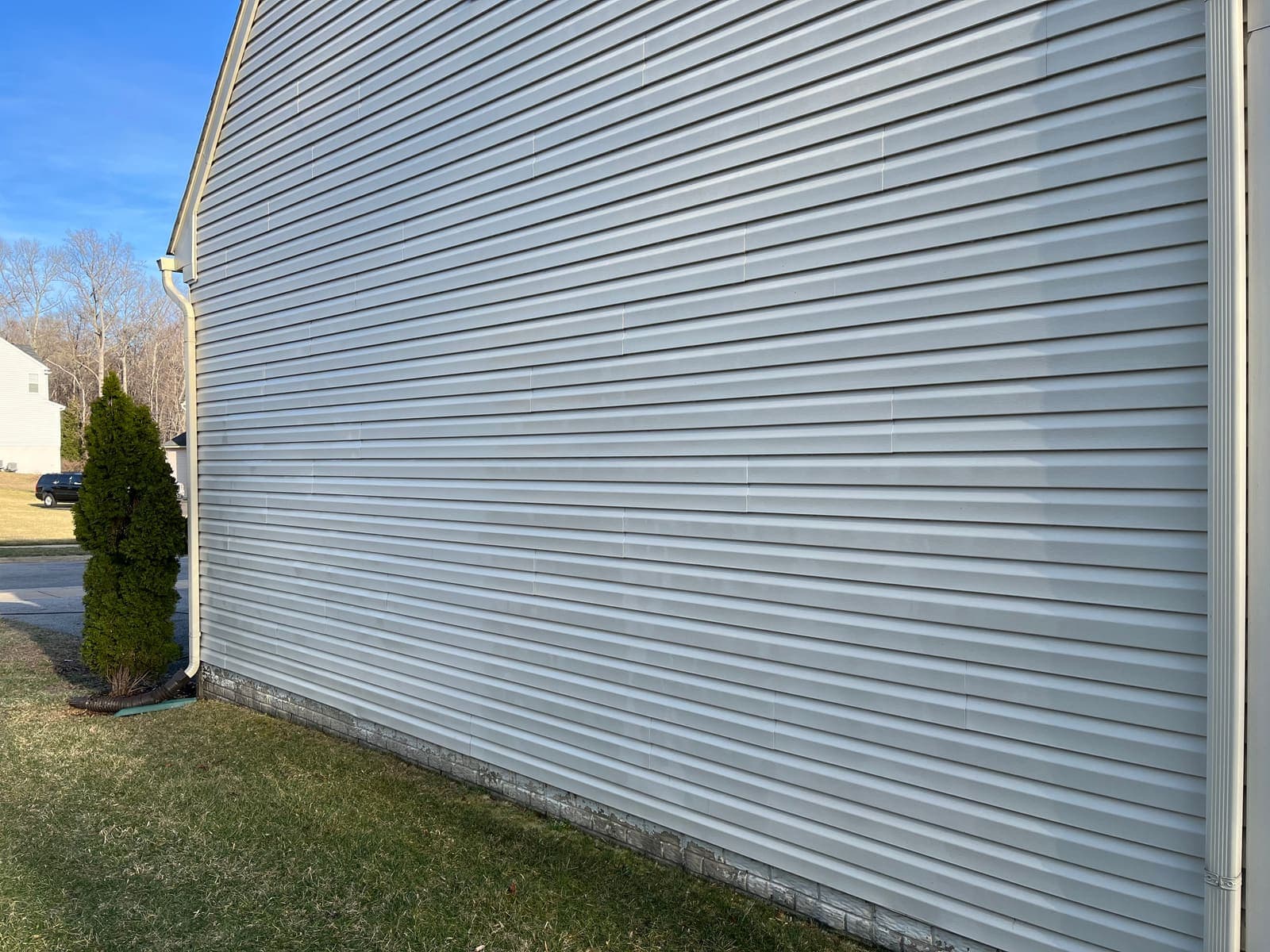Grey-sided house clean after washing