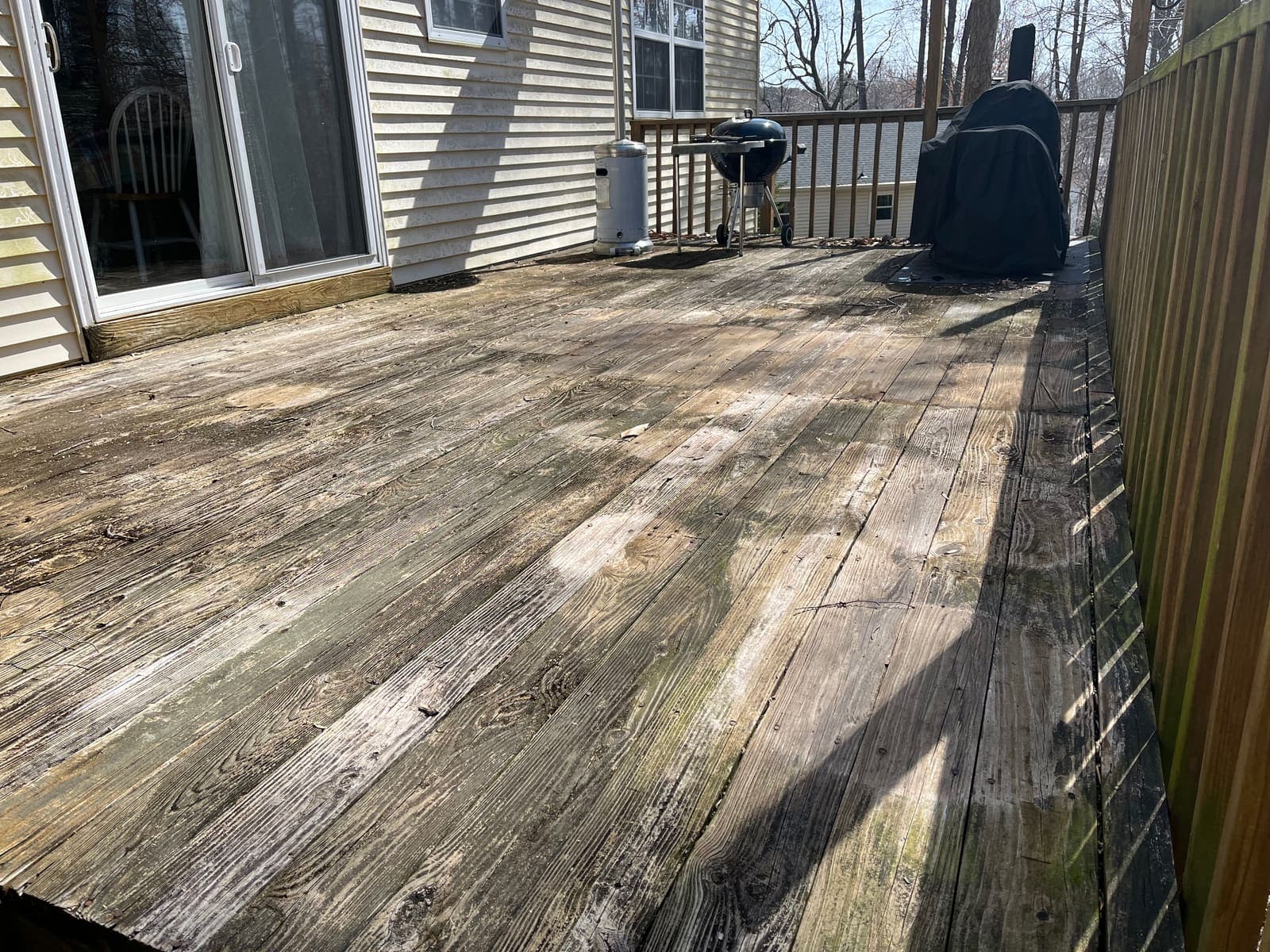 Large wood deck gone grey before restoration