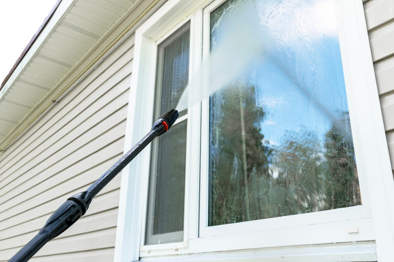 Cleaning exterior window glass, which coastal salt film dulls quickly