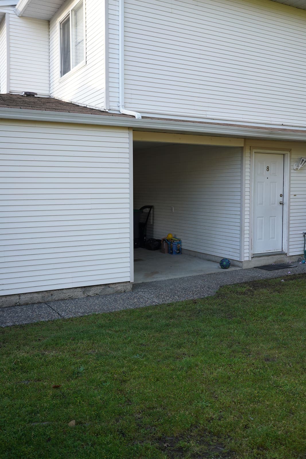 Townhouse carport and siding after pressure washing